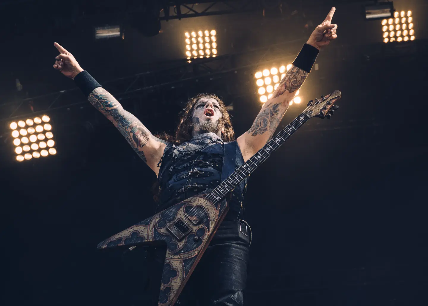 Metal vocalist performing under stage lights